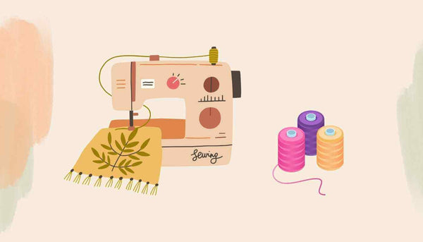 maquina de costura e linhas