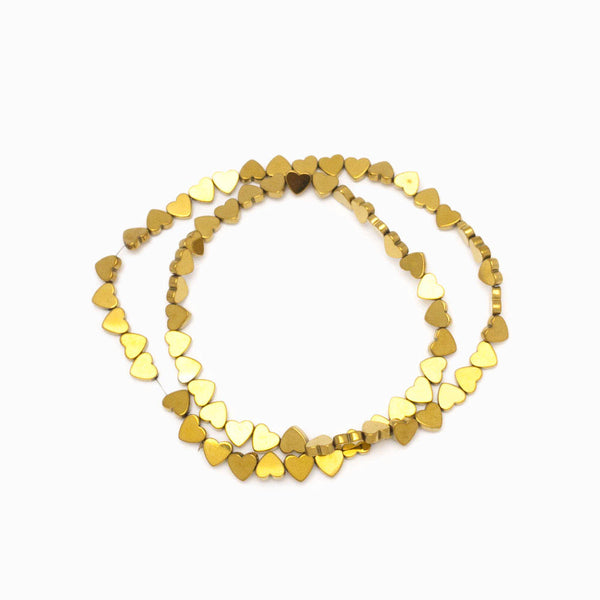 Contas de hematita coração dourado